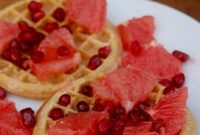 Whole-Grain Waffles with Orange Glaze and Pomegranate Seeds