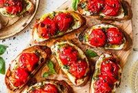 Baked Caprese Crostini with Fresh Basil Pesto