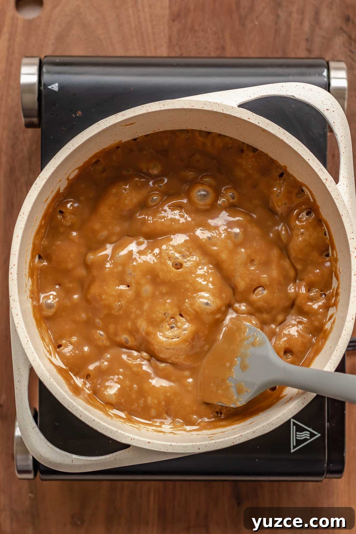 Salted Bourbon Caramel Candies: Sticky Sweet Whiskey Caramels 8 Bubbling caramel in a pot.