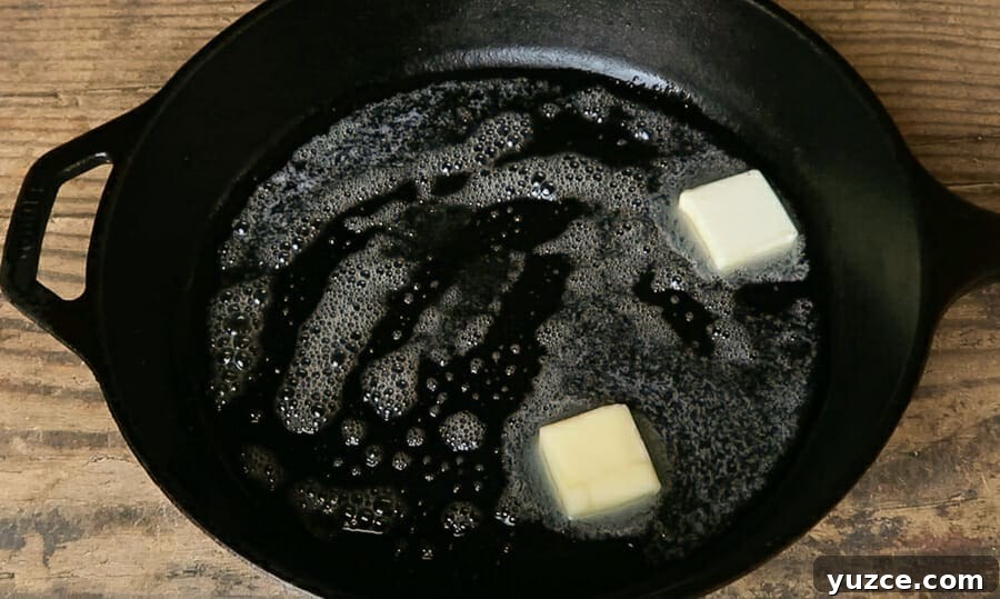 Buttery Skillet Cornbread Recipe — Moist Homemade Cornbread 4 cast iron skillet with butter melting inside