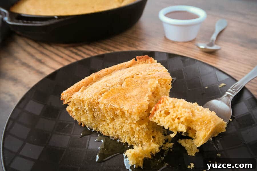 Buttery Skillet Cornbread Recipe — Moist Homemade Cornbread 5 easy skillet cornbread slice drizzled with honey