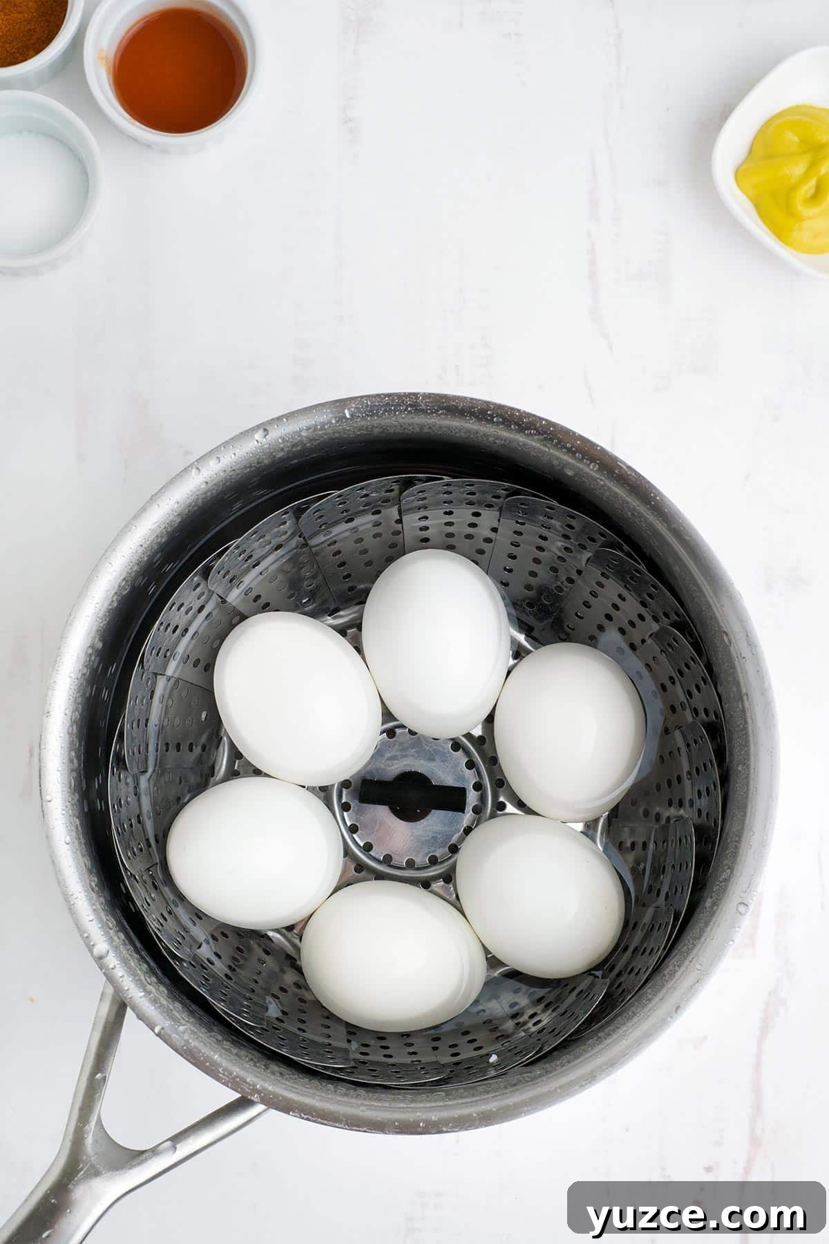 Jalapeño Bacon Deviled Eggs: Spicy Party Appetizer Recipe 4 Eggs boiled in a pot.