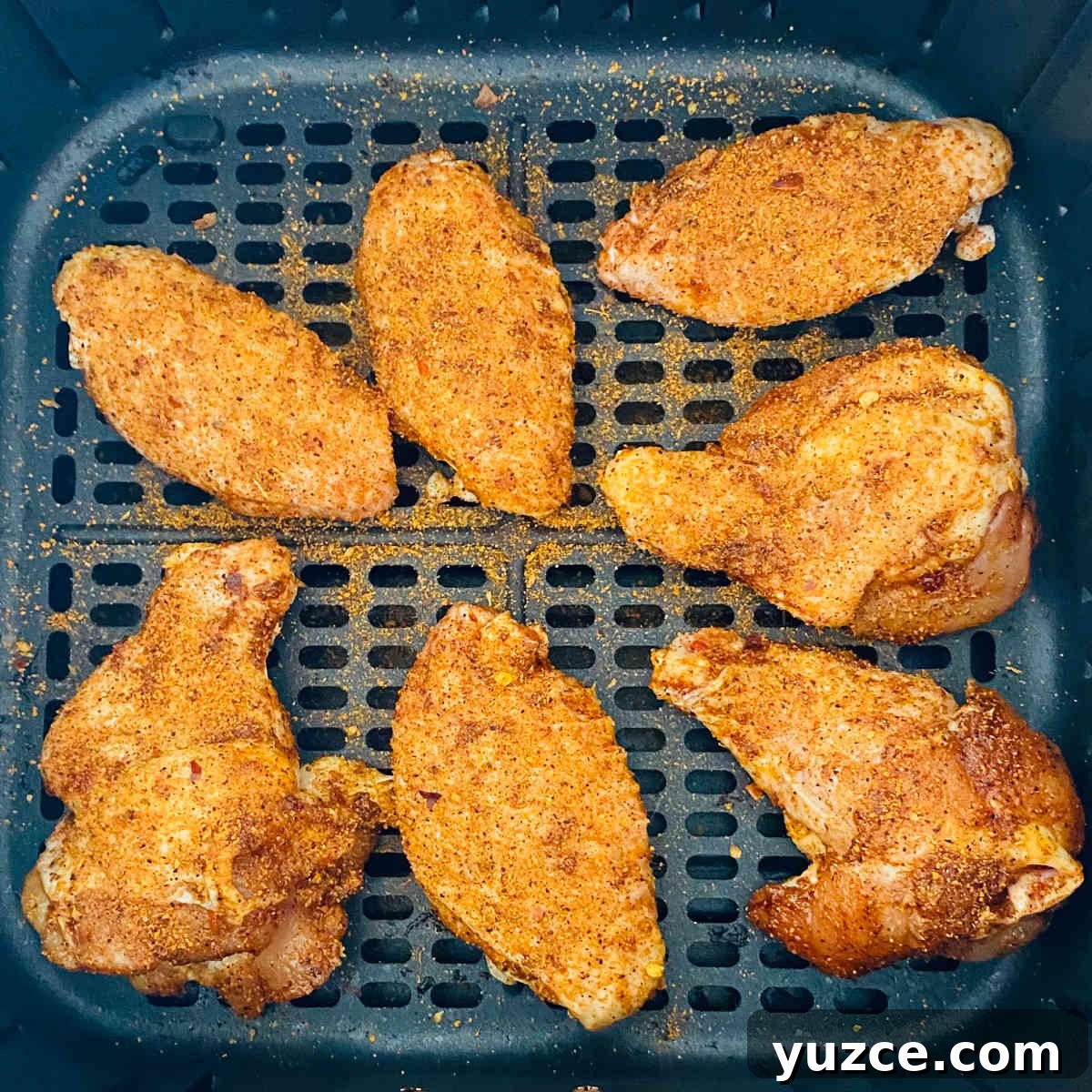 Crispy Cajun Chicken Wings Recipe: Spicy Oven-Baked Wings 4 cajun wings with dry rub in air fryer basket