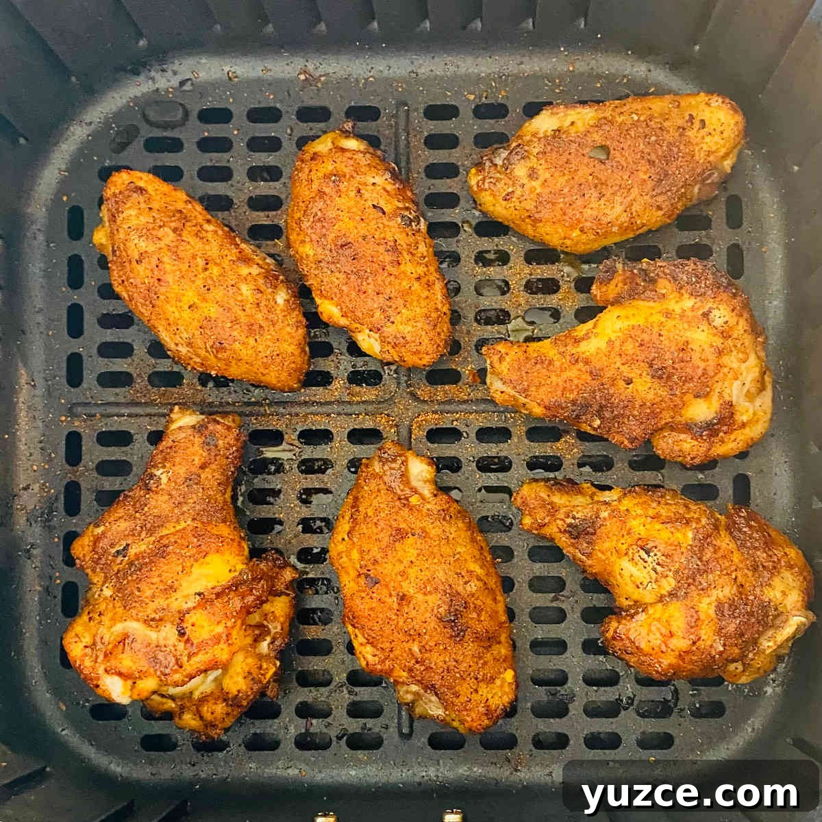 Crispy Cajun Chicken Wings Recipe: Spicy Oven-Baked Wings 6 air fryer cajun wings in air fryer basket