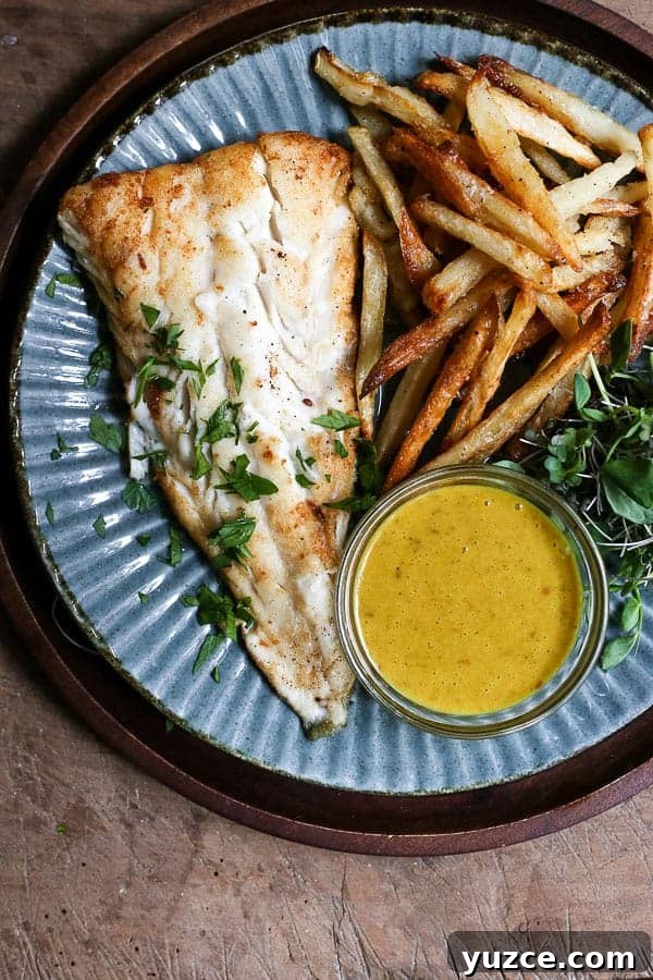 Crispy Gluten-Free Fish and Chips Recipe for Home Cooking 2 A plate of fish and chips with curry sauce