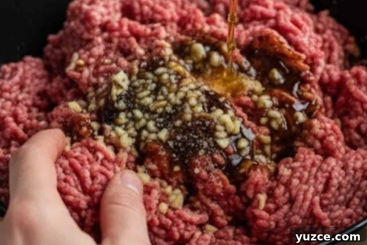 Aussie Drunken Burger Recipe: Beer-Braised Beef with Caramelized Onions 4 Combine beef, garlic, Worcestershire, beer, salt, and pepper. Use hands to mix