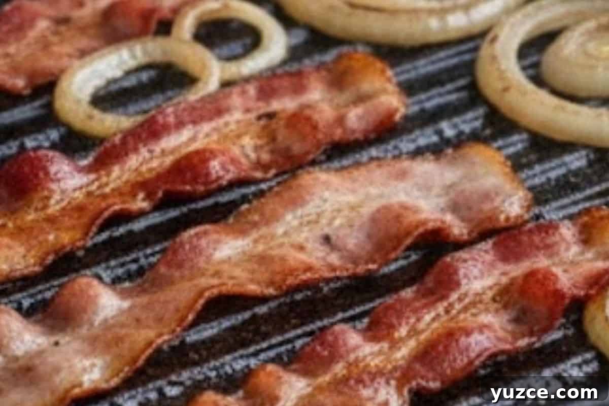 Aussie Drunken Burger Recipe: Beer-Braised Beef with Caramelized Onions 7 In a separate pan, fry the sliced onion and bacon until the onion turns fragrant and translucent and the bacon is nice and crispy.