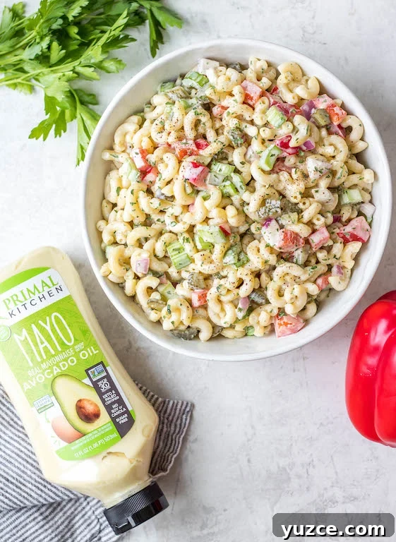 This easy, creamy macaroni salad is a flavorful pasta salad side dish that is the perfect combination of sweet and tart. The mayo based dressing is simple and not too overpowering, and it's sure to be a hit at every potluck or BBQ this summer! Made with sweet pickles, red onion, celery and red pepper, it can be made gluten free, dairy free, vegan and in under 30 minutes! #creamypastasalad #veganmacaronisalad #macaronisalad #sidedish This easy, creamy macaroni salad is a flavorful pasta salad side dish that is the perfect combination of sweet and tart. The mayo based dressing is simple and not too overpowering, and it's sure to be a hit at every potluck or BBQ this summer! Made with sweet pickles, red onion, celery and red pepper, it can be made gluten free, dairy free, vegan and in under 30 minutes! #creamypastasalad #veganmacaronisalad #macaronisalad #sidedish