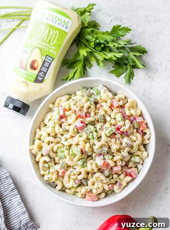 This easy, creamy macaroni salad is a flavorful pasta salad side dish that is the perfect combination of sweet and tart. The mayo based dressing is simple and not too overpowering, and it's sure to be a hit at every potluck or BBQ this summer! Made with sweet pickles, red onion, celery and red pepper, it can be made gluten free, dairy free, vegan and in under 30 minutes! #creamypastasalad #veganmacaronisalad #macaronisalad #sidedish This easy, creamy macaroni salad is a flavorful pasta salad side dish that is the perfect combination of sweet and tart. The mayo based dressing is simple and not too overpowering, and it's sure to be a hit at every potluck or BBQ this summer! Made with sweet pickles, red onion, celery and red pepper, it can be made gluten free, dairy free, vegan and in under 30 minutes! #creamypastasalad #veganmacaronisalad #macaronisalad #sidedish