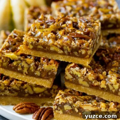 Irresistible Pecan Pie Bars Recipe with Buttery Shortbread Crust 7 A serving platter full of pecan pie bars.