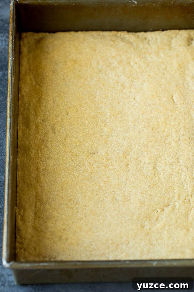 Shortbread crust in pan A shortbread crust in a baking pan.