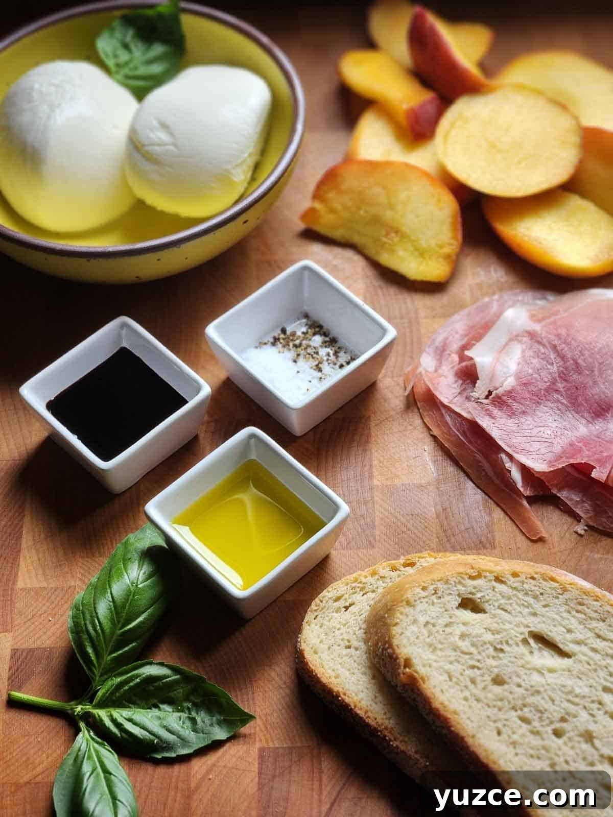 Peach, Prosciutto & Burrata Panini Recipe for Summer Sandwiches 3 Ingredients for a peach panini on a cutting board.
