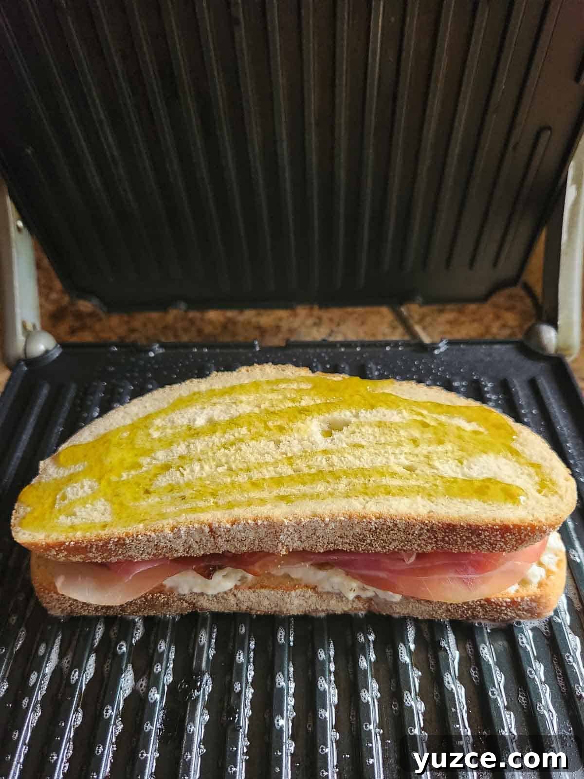 Peach, Prosciutto & Burrata Panini Recipe for Summer Sandwiches 5 A peach panini on an electric panini maker.