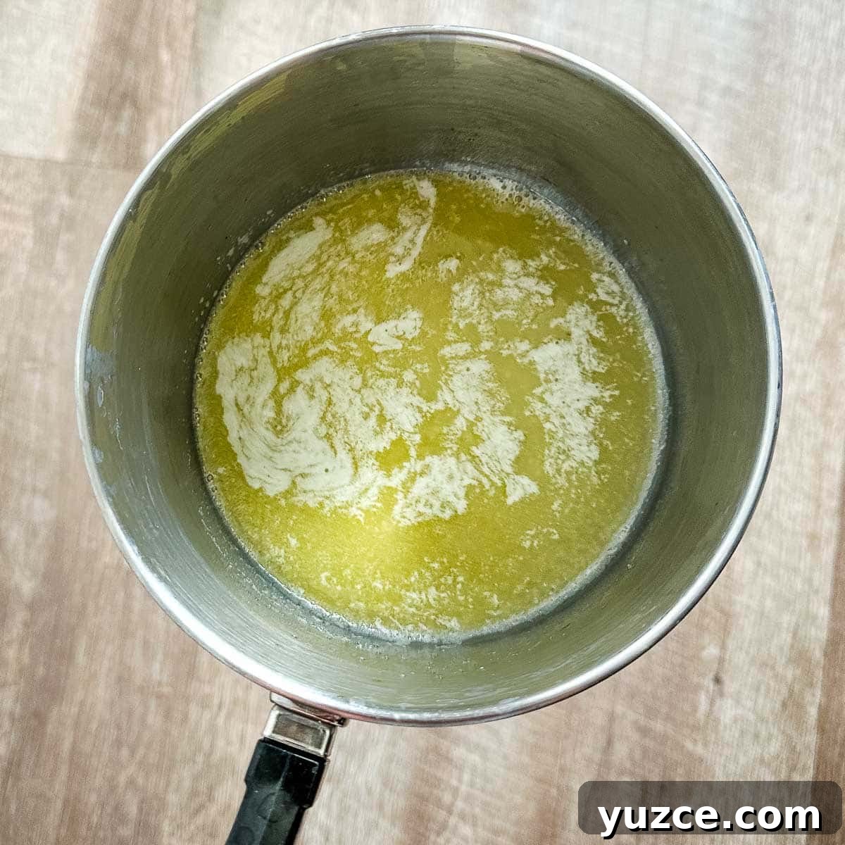 Homemade Hot Honey Sauce Recipe for Spicy-Sweet Dishes 4 Melted butter in a saucepot.