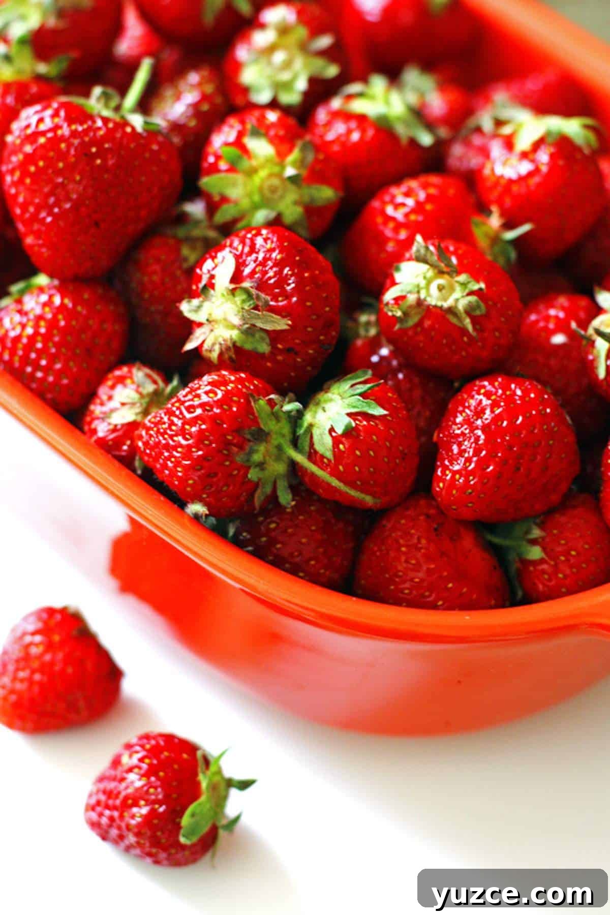 Strawberry Rhubarb Crumble Bars Recipe — Sweet Tart Dessert Bars 4 A bowl of fresh strawberries for crumble bars.
