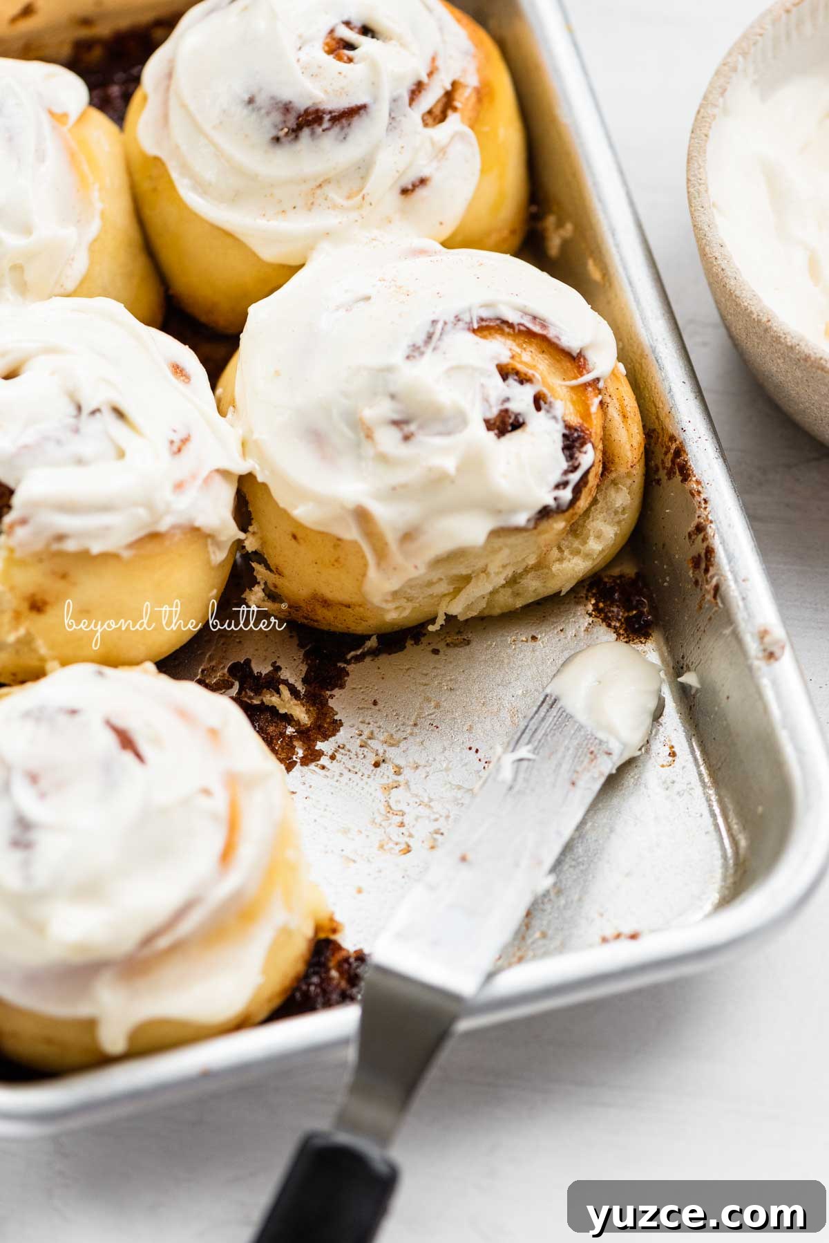 Cinnamon Rolls for Two: Small-Batch Recipe with Gooey Frosting 6 Just frosted small batch cinnamon rolls from BeyondtheButter.com | © Beyond the Butter®