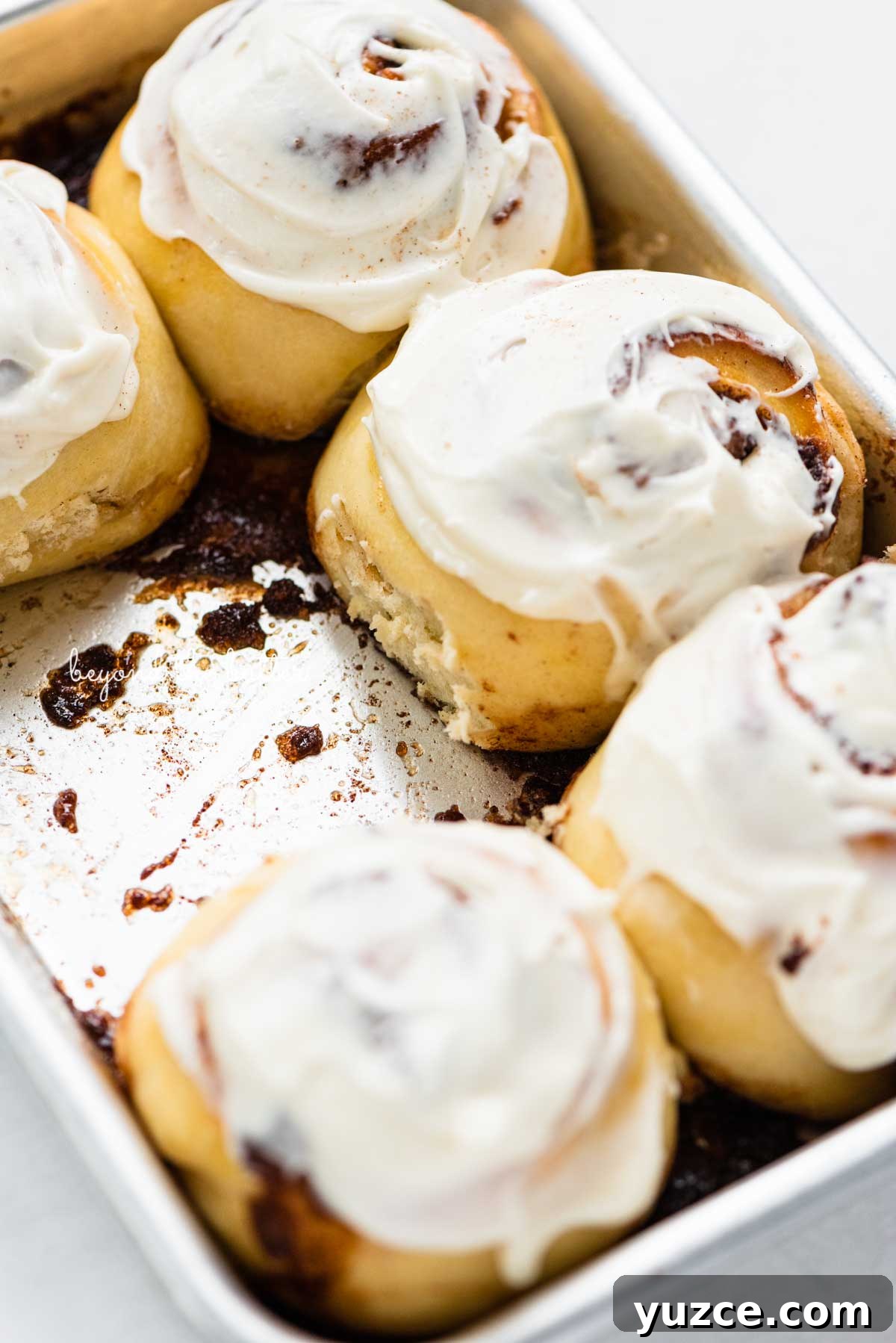 Cinnamon Rolls for Two: Small-Batch Recipe with Gooey Frosting 7 Just frosted small batch cinnamon rolls from BeyondtheButter.com | © Beyond the Butter®