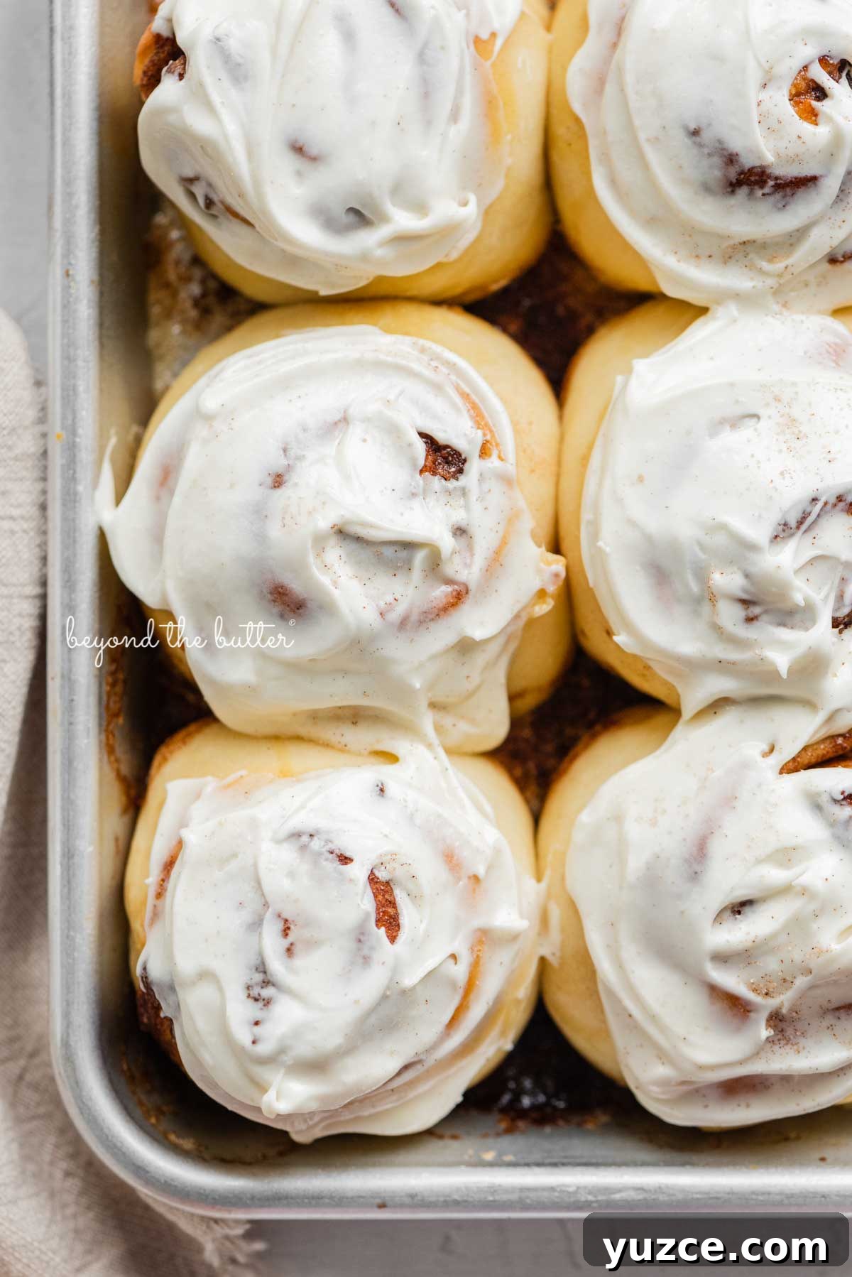Cinnamon Rolls for Two: Small-Batch Recipe with Gooey Frosting 8 Just frosted small batch cinnamon rolls from BeyondtheButter.com | © Beyond the Butter®