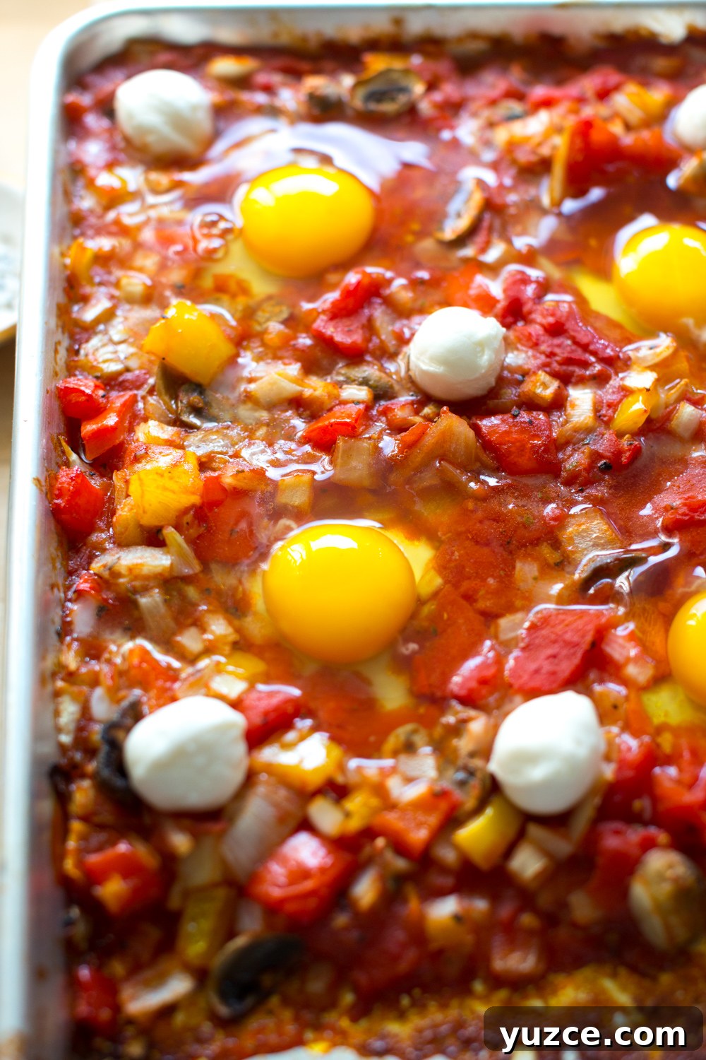 Sheet Pan Italian Baked Eggs with Tomatoes and Herbs 7 Sheet Pan Italian Baked Eggs drop