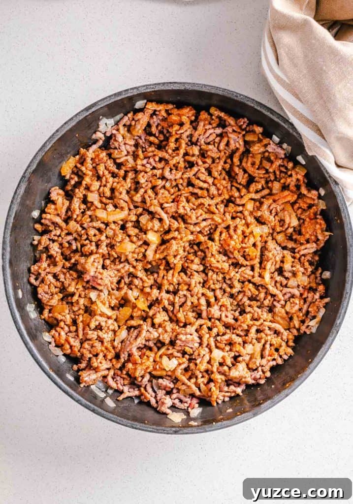 Ground Beef Lettuce Wraps with Hoisin Lime Sauce 7 Cooked ground beef in a pan.