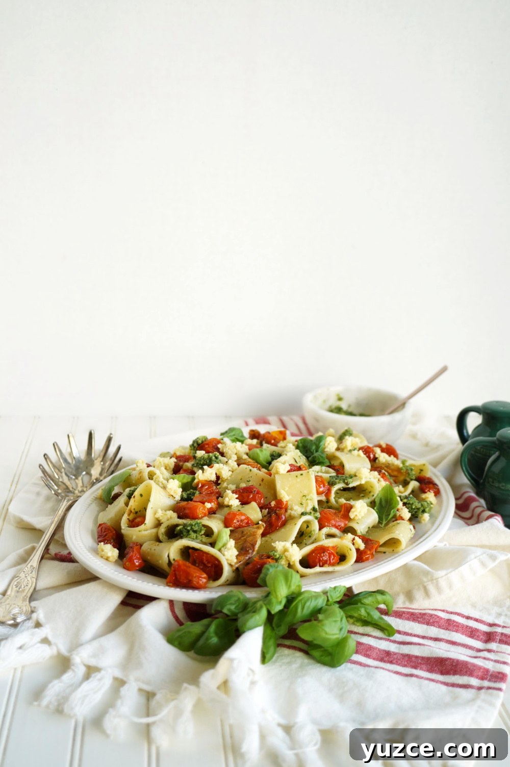 Vegan Pesto Pasta with Roasted Tomatoes & Almond Ricotta 5 panoramic shot of plate of pesto pasta with roasted tomatoes