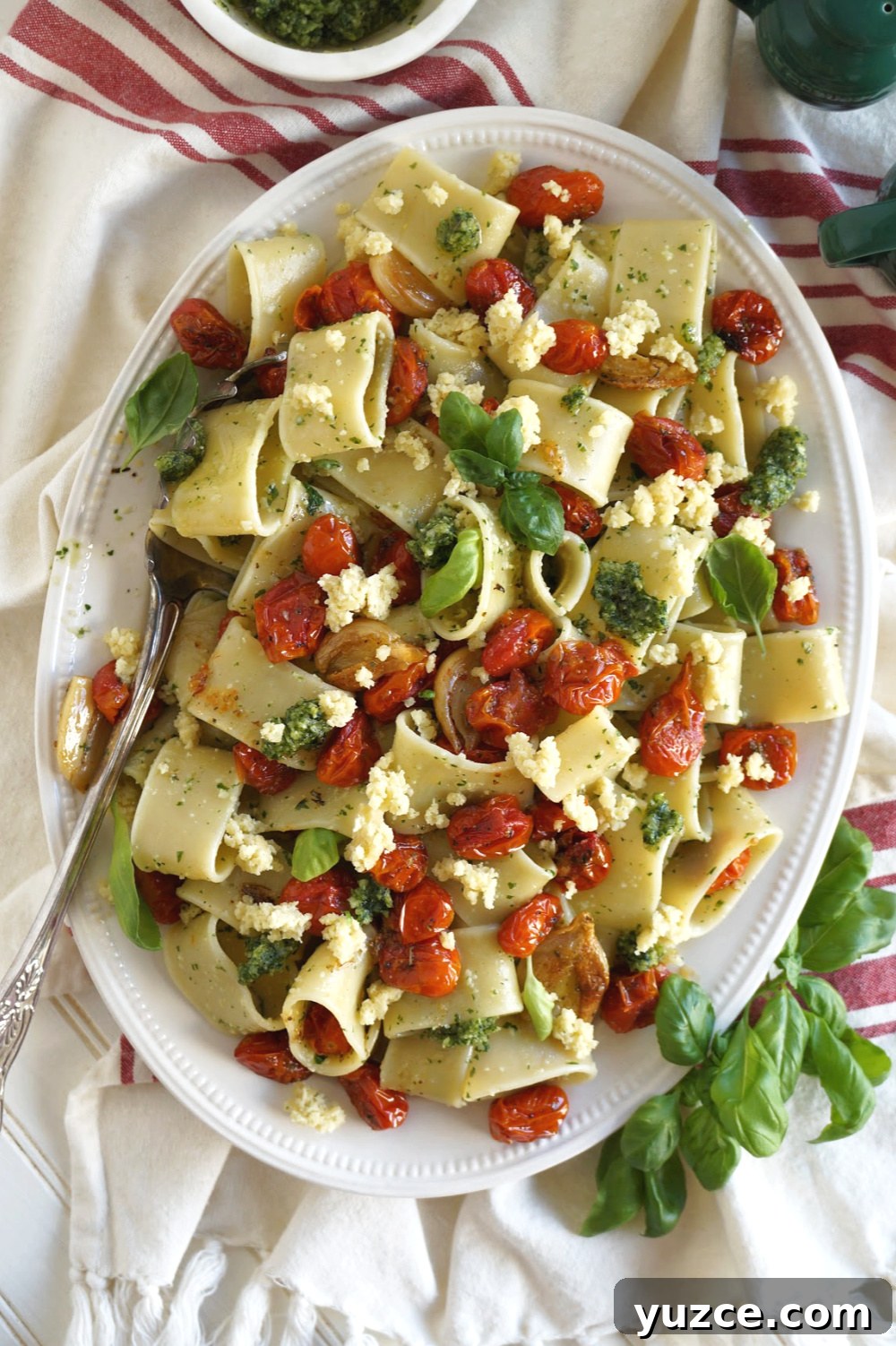 Vegan Pesto Pasta with Roasted Tomatoes & Almond Ricotta 6 overhead shot of pasta with serving spoon
