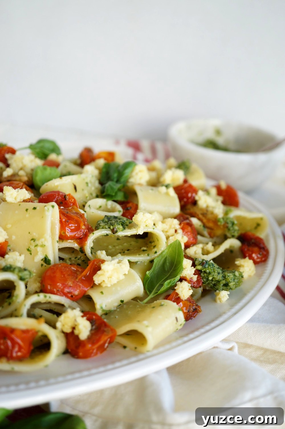 Vegan Pesto Pasta with Roasted Tomatoes & Almond Ricotta 8 close up of plate of pesto pasta