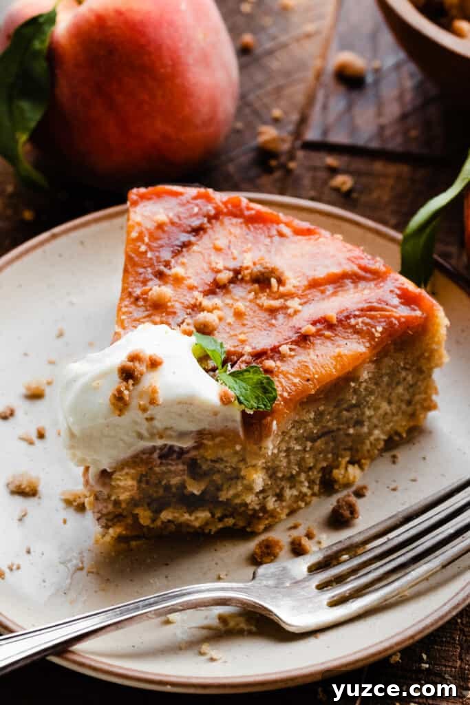 A close-up of a slice of the cake on a plate, with a bite missing.