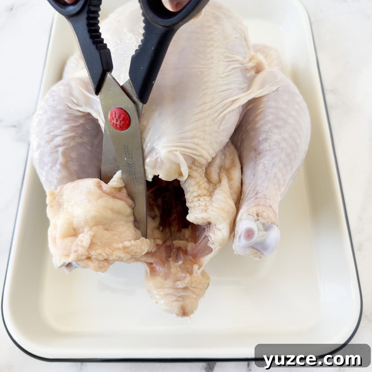 Perfectly Grilled Rotisserie Chicken: Tips for Juicy, Crispy Results 4 Trim excess fat from the chicken around the cavity and at the tail end.