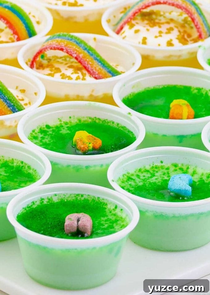 Key Lime Lucky Charms Jello Shots Recipe 2 Key Lime Lucky Charms Jello Shots and pot o gold hots on a white tray.