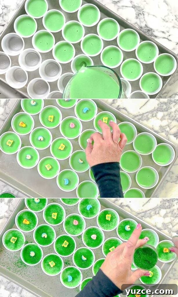 Key Lime Lucky Charms Jello Shots Recipe 5 portion cups being filled with liquid , lucky charms, and sprinkles.