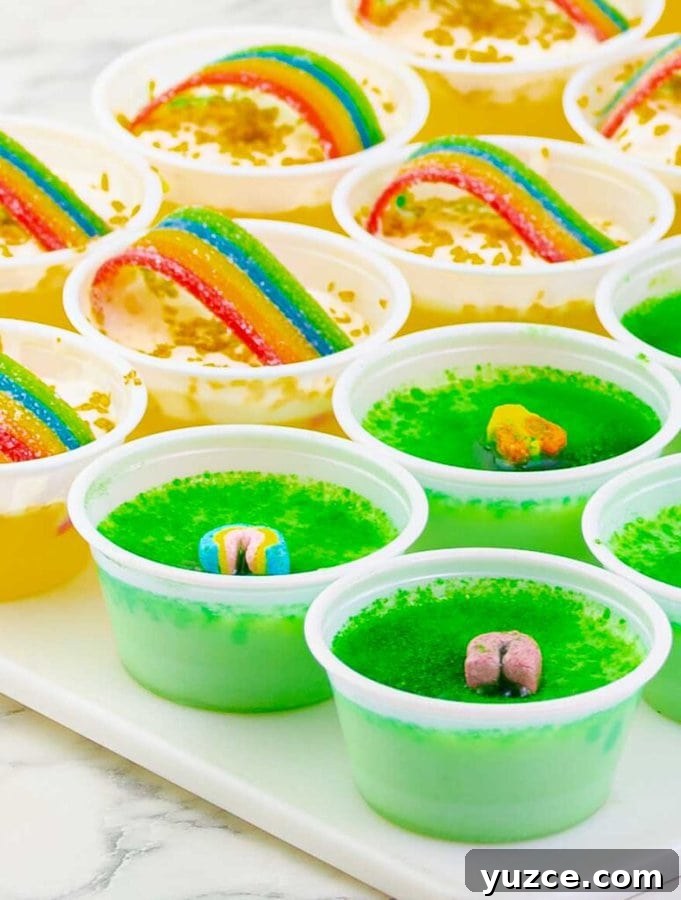 Key Lime Lucky Charms Jello Shots Recipe 7 Key Lime Lucky Charms Jello Shots and pot o gold hots on a white tray.
