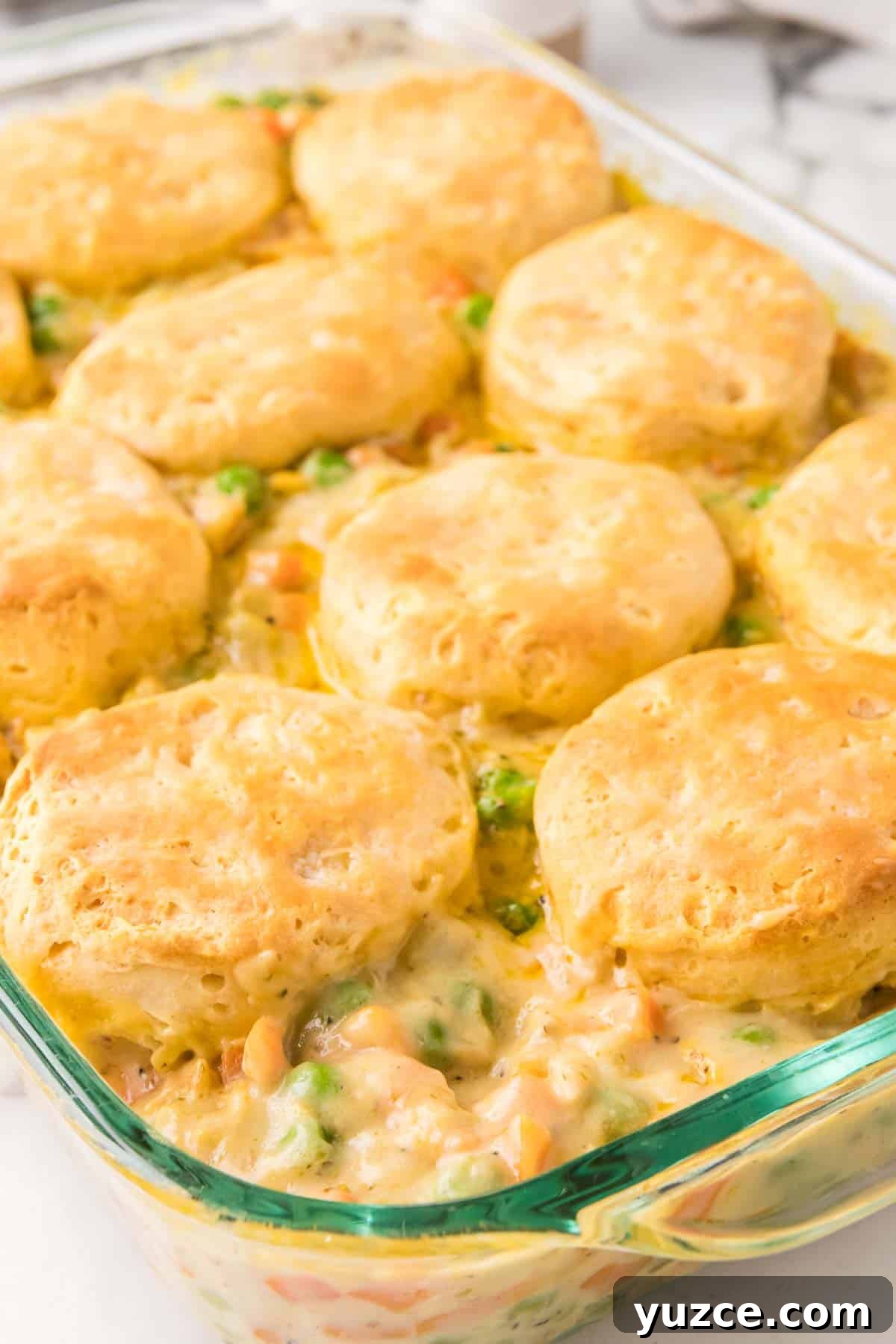 Chicken Pot Pie Casserole Topped with Golden Biscuits 12 Chicken pot pie casserole with biscuits