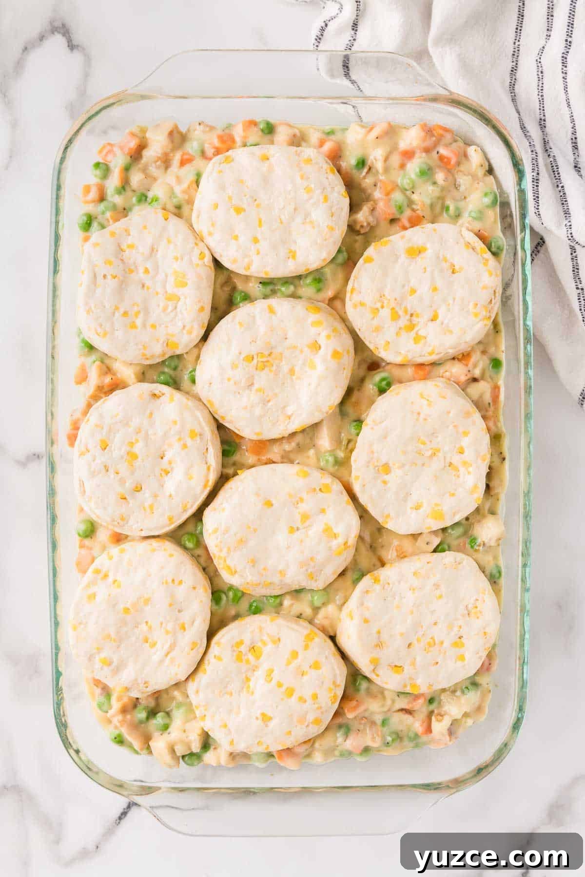 Chicken Pot Pie Casserole Topped with Golden Biscuits 7 Refrigerated biscuits are evenly layered over the pot pie filling