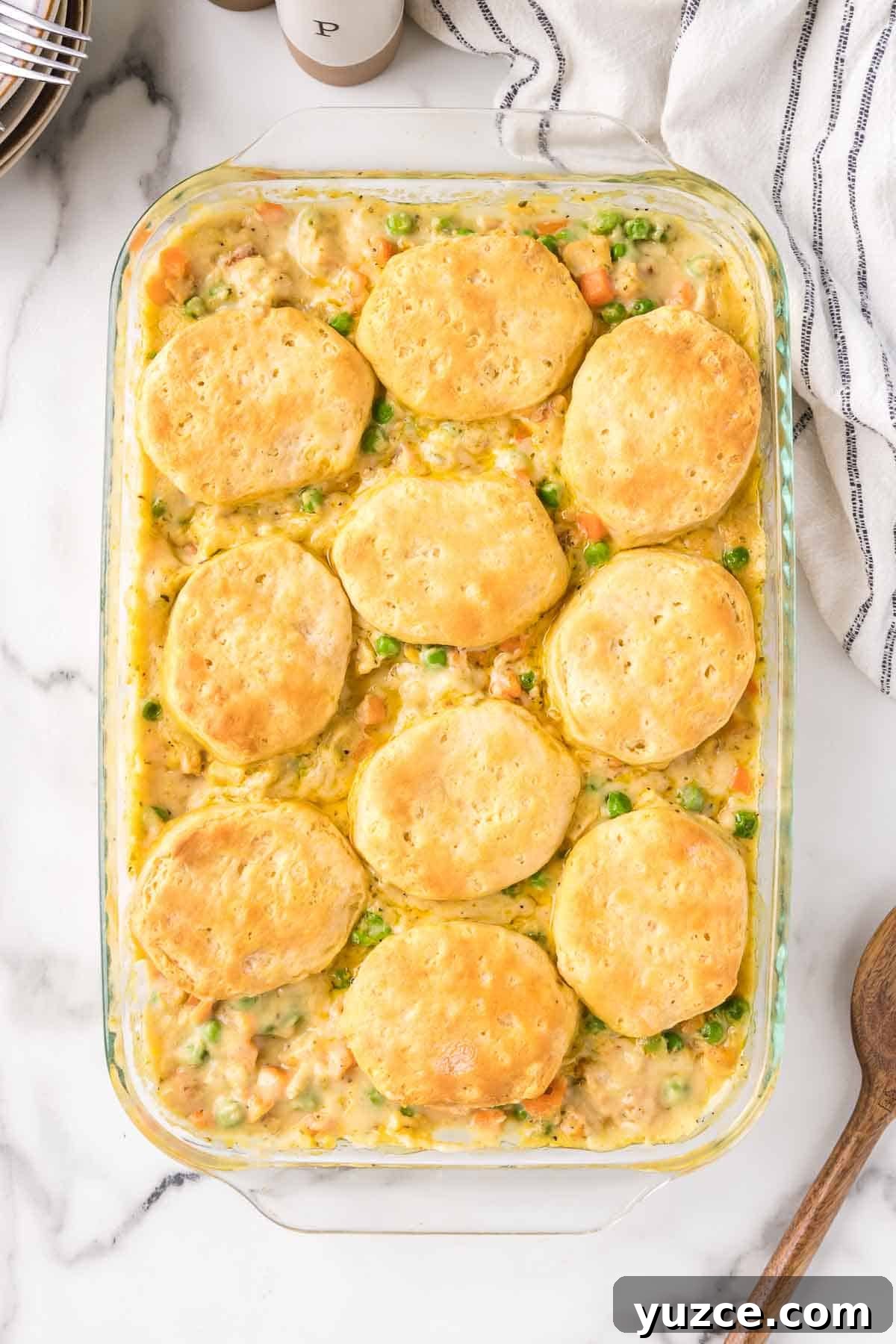 Chicken Pot Pie Casserole Topped with Golden Biscuits 8 Chicken pot pie casserole is baked until the biscuits are golden