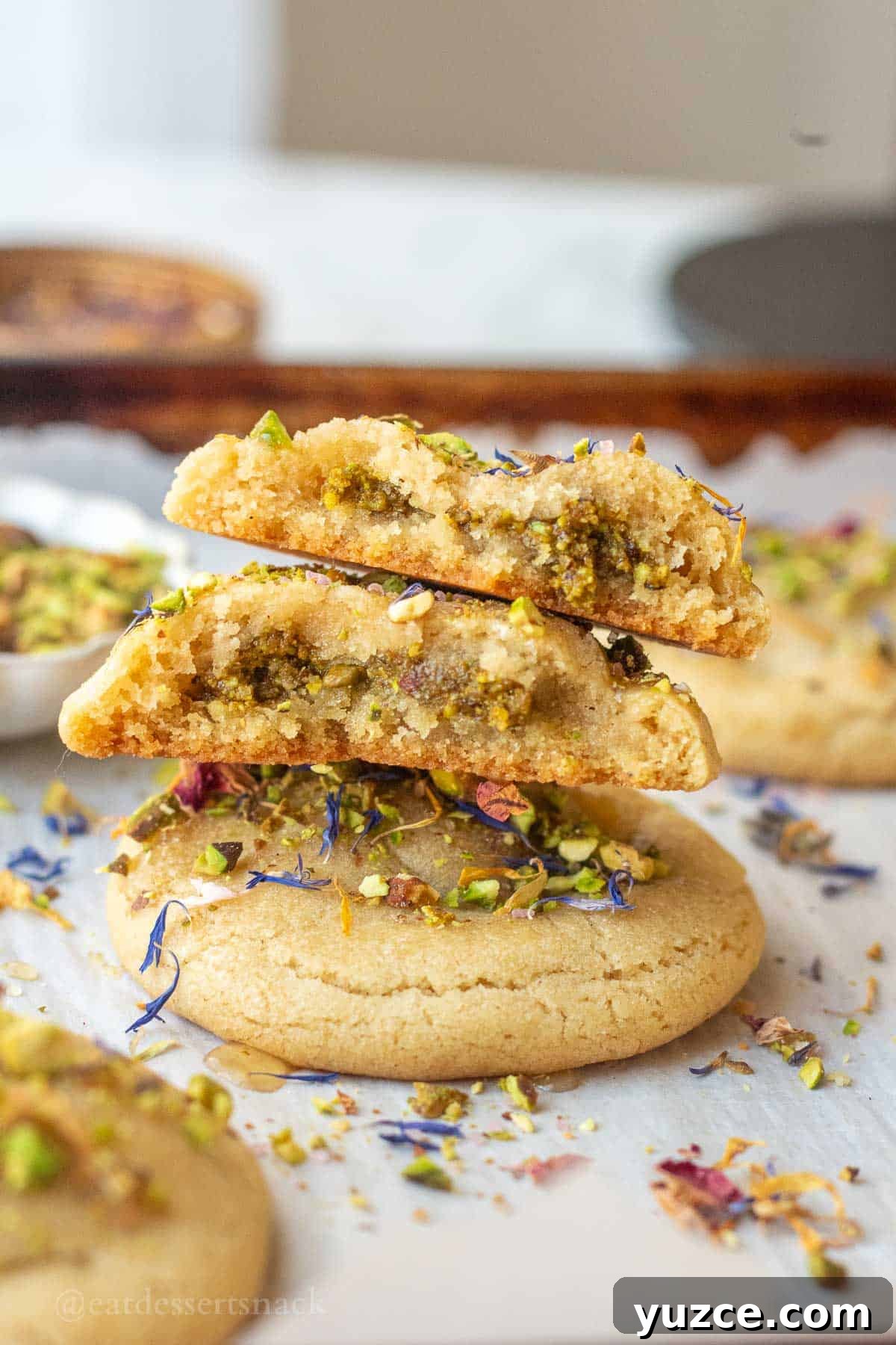 Baklava Cookie Recipe: Crispy Phyllo Pastry with Honey-Nut Filling 6 Halved baklava cookies on baking sheet stacked.