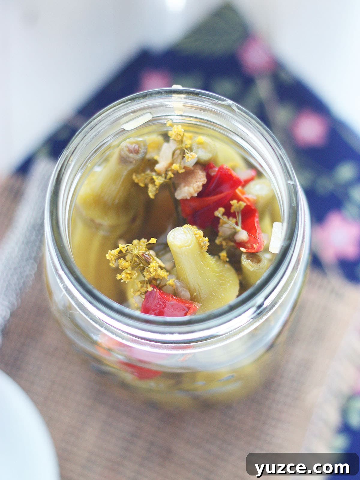 Tangy Spicy Pickled Okra Recipe for Bold Flavor 9 Looking down into an open jar of pickled okra.