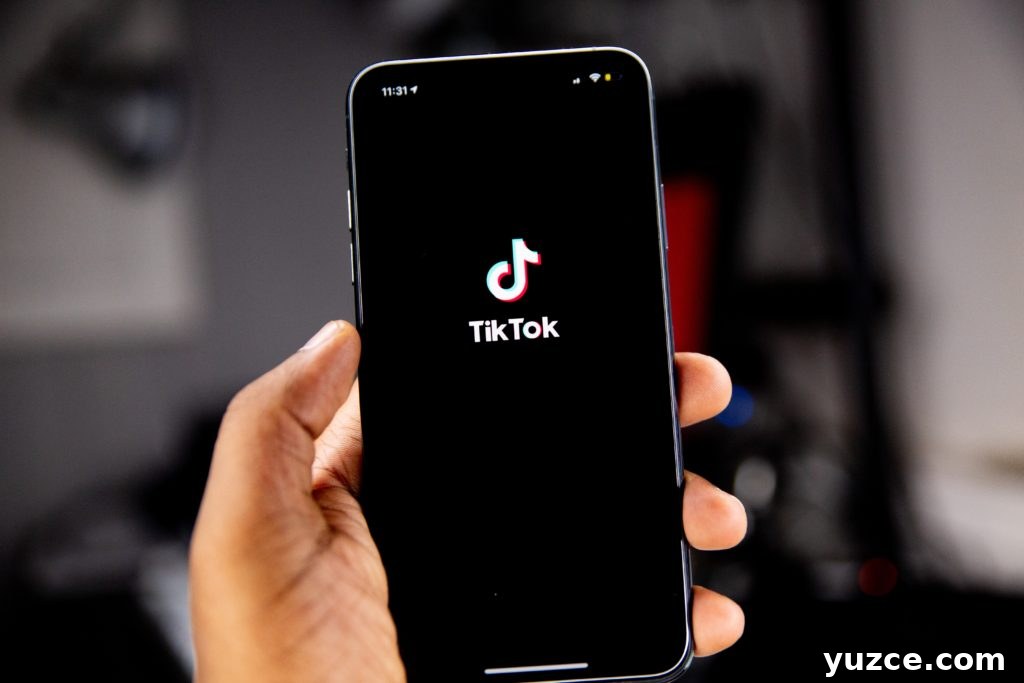 solen-feyissa-Yaw9mfG9QfQ-unsplash A person holding their cell phone up with the TikTok app opened up.