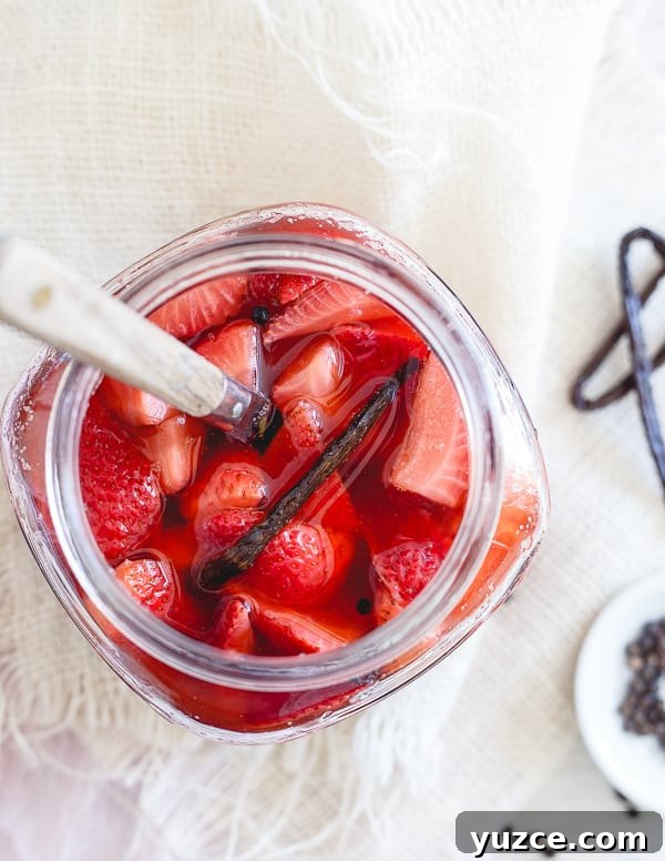 Vanilla Bean Pickled Strawberries: Sweet-Tart Preserved Berries 4 Pickled strawberries in a glass jar.