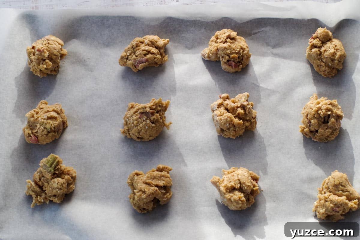 Brown Sugar Oatmeal Cookies with Tangy Rhubarb 11 cookie dough in heaping tablespoons on a parchment lined baking sheet