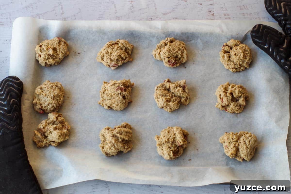 Brown Sugar Oatmeal Cookies with Tangy Rhubarb 12 baked cookies on parchment covered baking sheet
