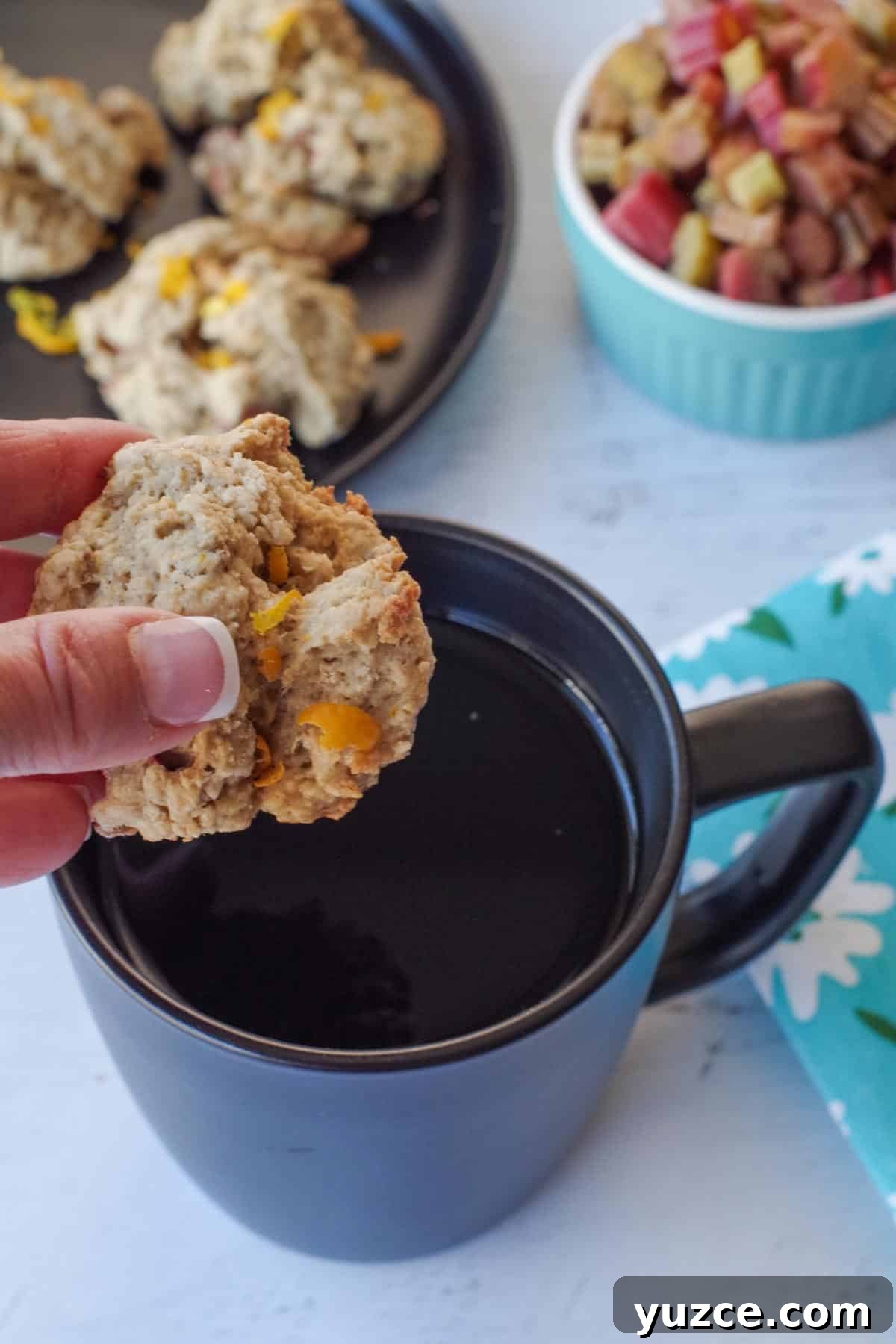 Brown Sugar Oatmeal Cookies with Tangy Rhubarb 15 rhubarb cookie being dipped into a black mug of coffee