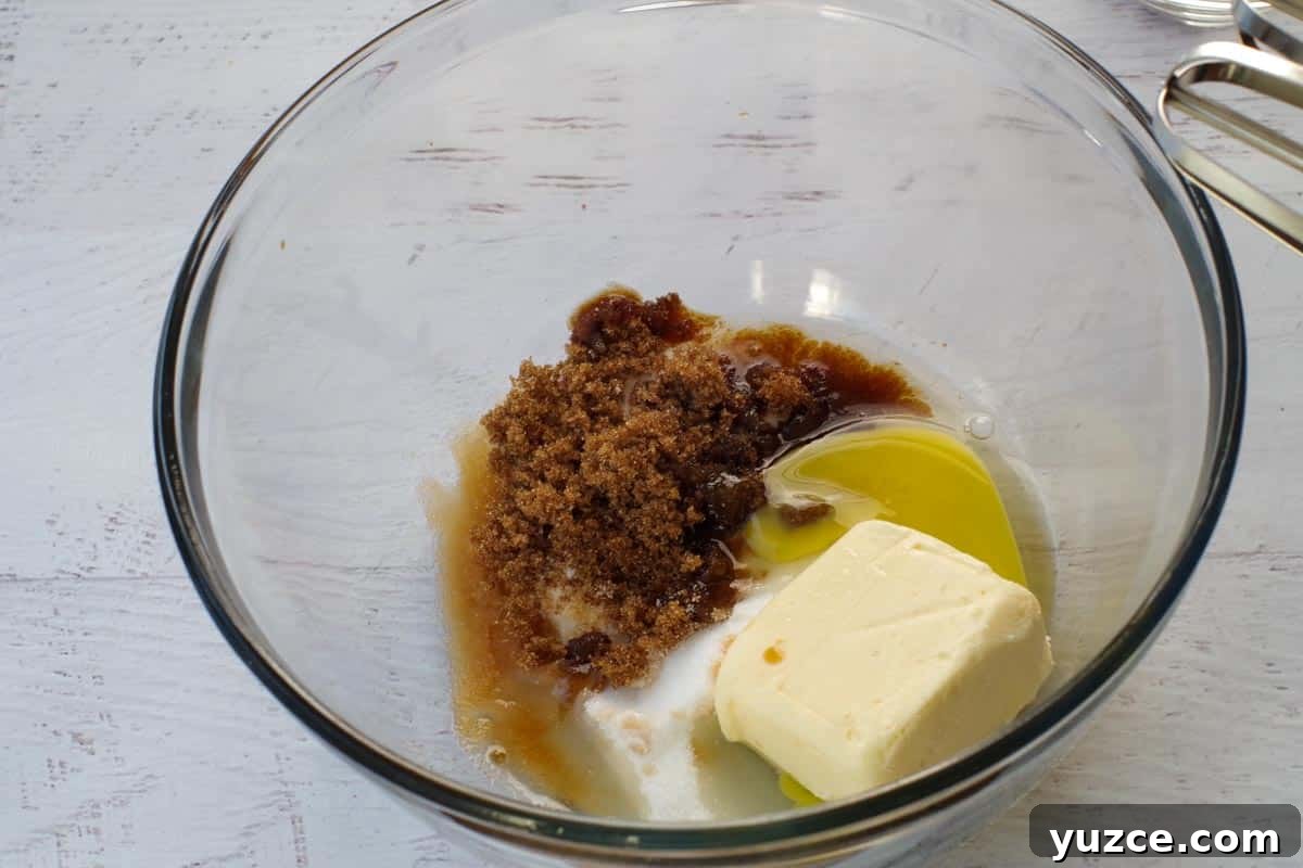Brown Sugar Oatmeal Cookies with Tangy Rhubarb 5 sugars, butter, egg and vanilla extract in a glass bowl