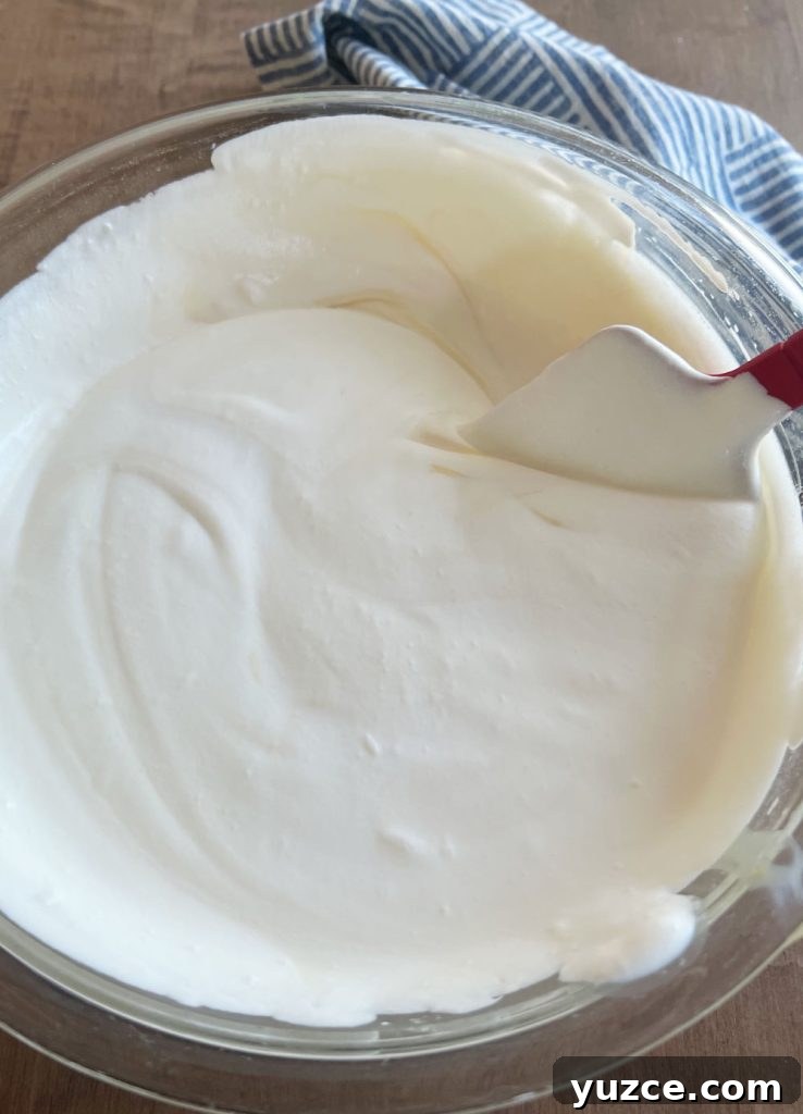 3-Ingredient Oreo Ice Cream Recipe You Can Make Tonight 5 fold whipped cream into sweetened condensed milk in large mixing bowl