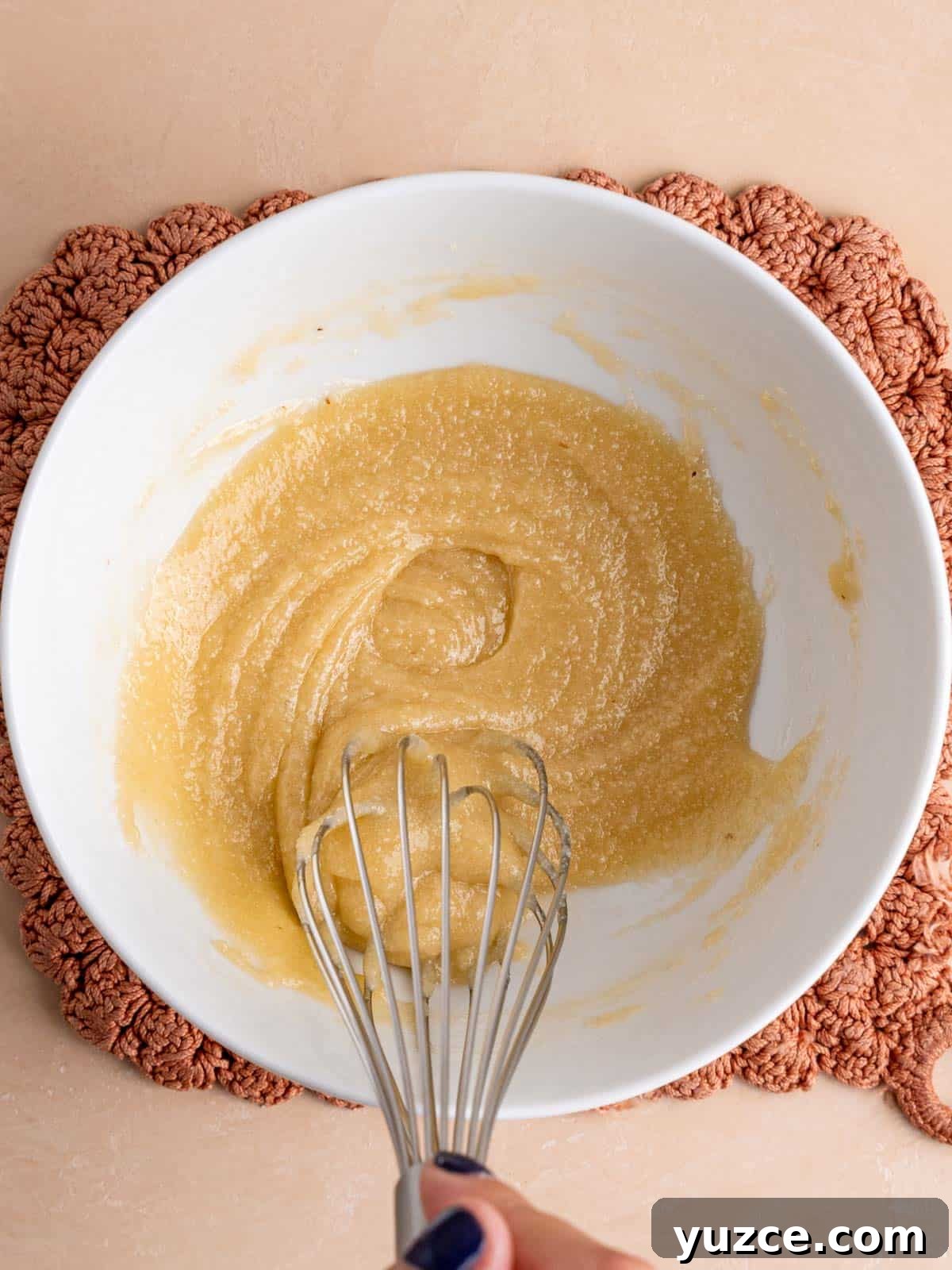 4-Ingredient Lace Cookies Recipe: Crispy Thin Cookie Delight 5 Whisking almond flour and sugar into melted butter and honey.