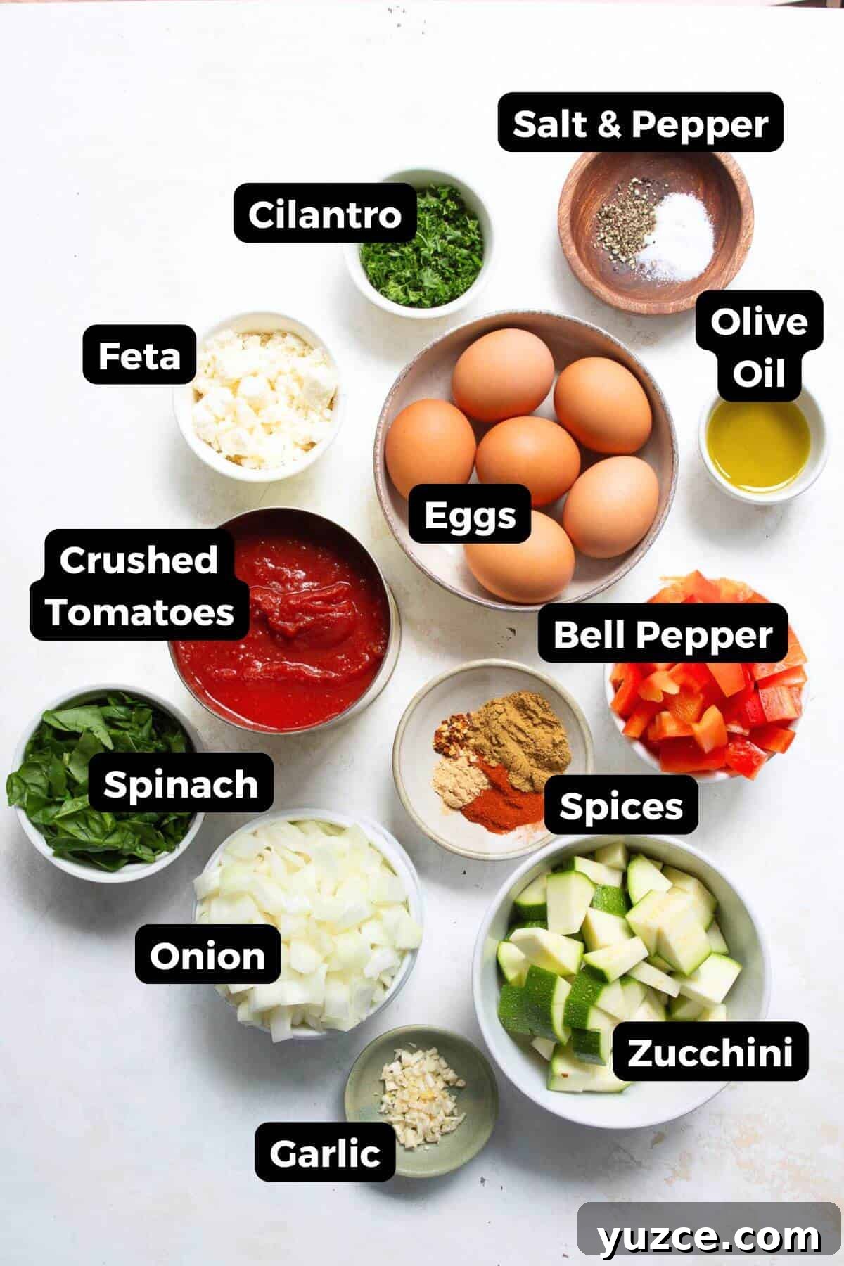 Perfect Shakshuka Recipe: Flavorful One-Pan Eggs and Tomatoes 3 All ingredients needed to make Mediterranean shakshuka with feta, labeled and ready to cook