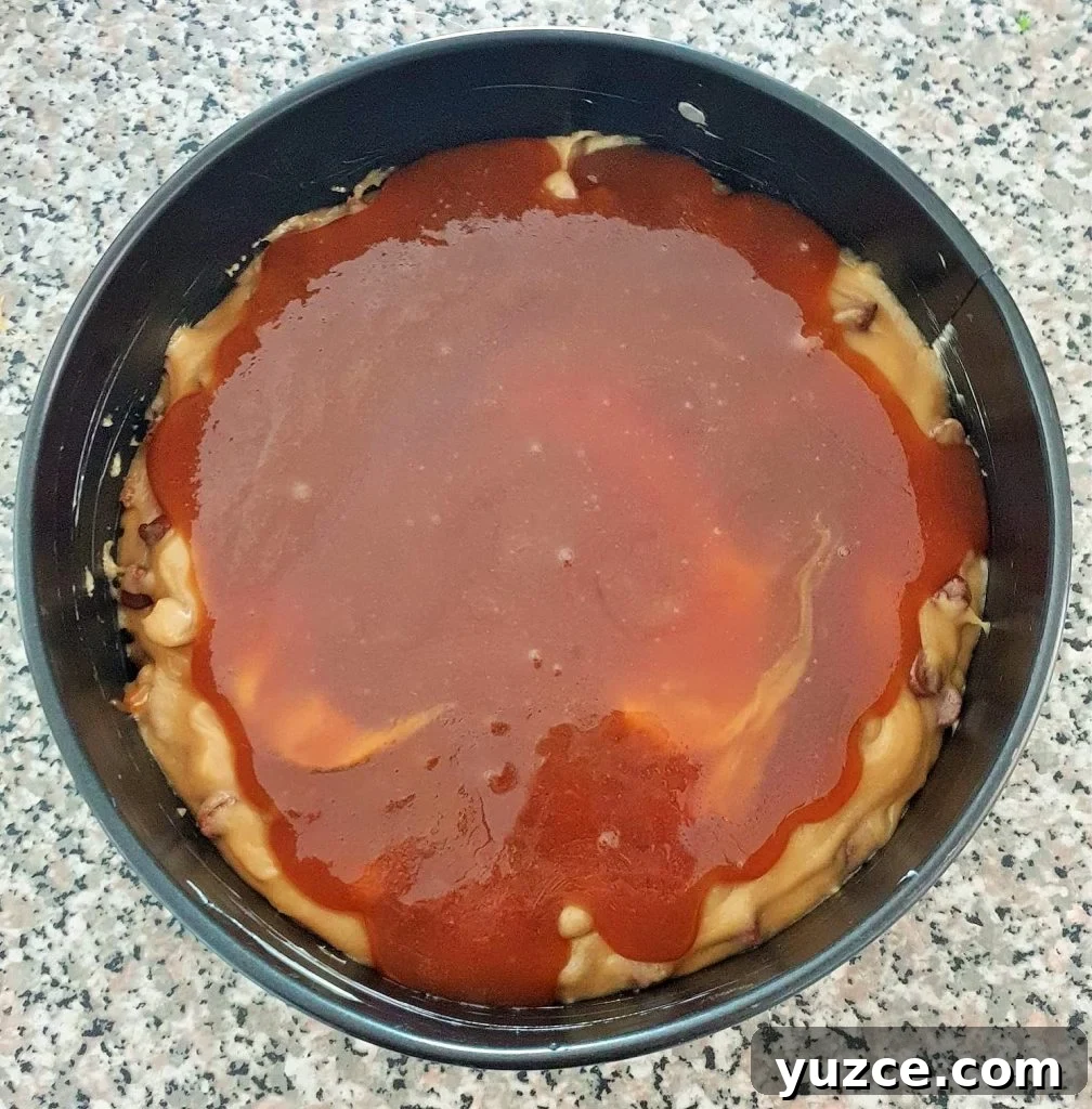 Salted Caramel Cookie Pie Recipe: Gooey, Crunchy Dessert Guide 11 Salted caramel sauce over cookie dough in a cake pan.