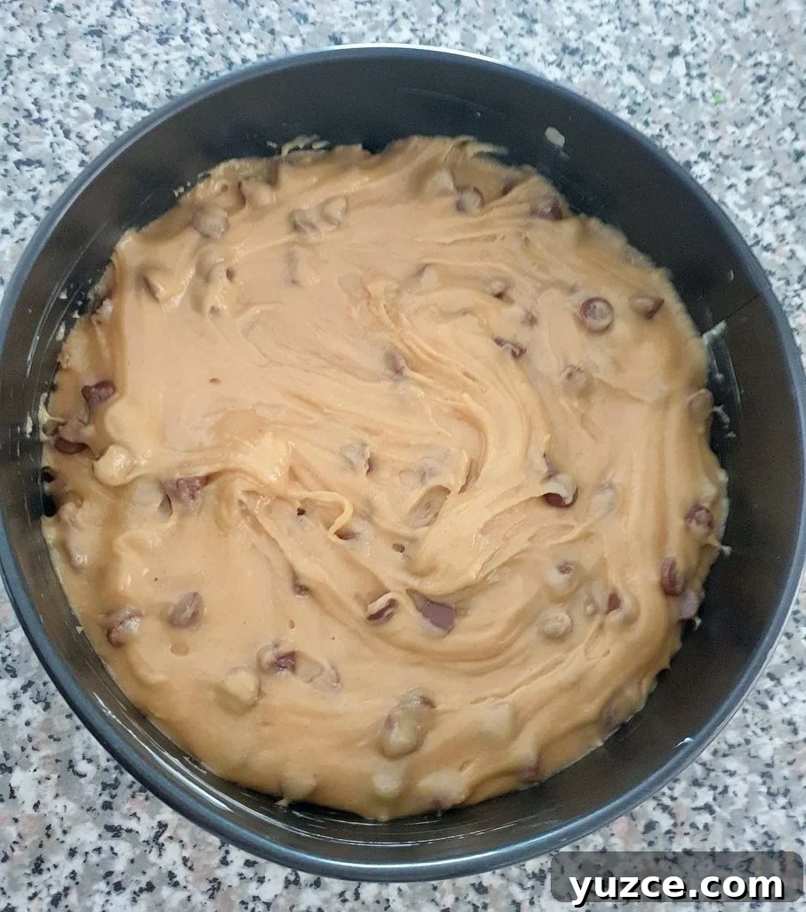 Salted Caramel Cookie Pie Recipe: Gooey, Crunchy Dessert Guide 10 Cookie dough in a cake pan.