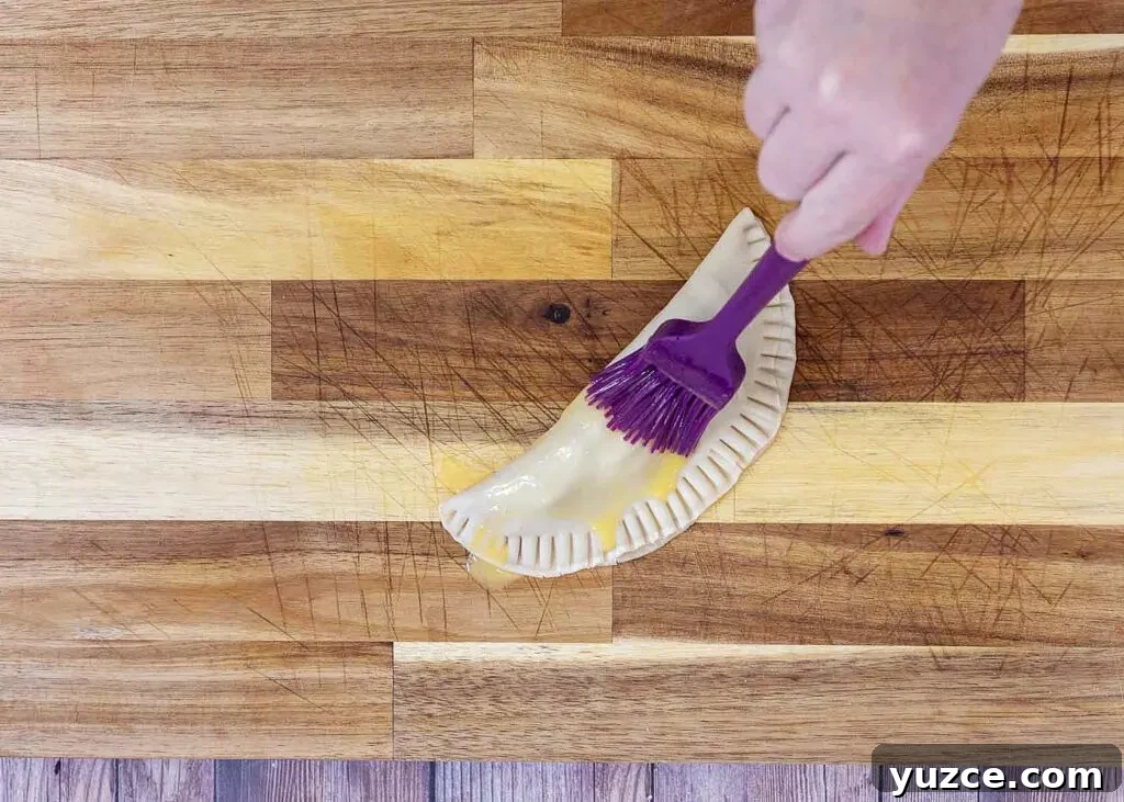 Air-Fried Apple Empanadas Recipe: Crispy Homemade Dessert 7 Brush with egg wash
