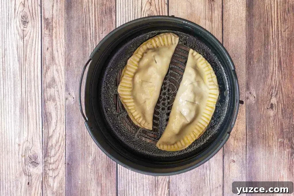 Air-Fried Apple Empanadas Recipe: Crispy Homemade Dessert 9 Place in the air fryer in a single layer